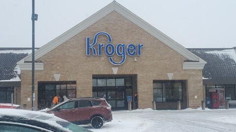 Kroger grocery storefront with company sign in winter snow