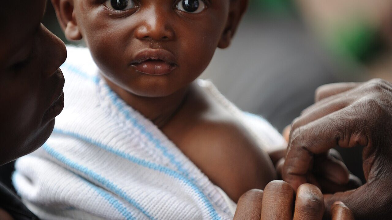 Child being vaccinated against measles