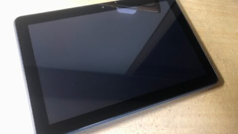 Amazon Kindle Fire tablet lying on a wooden table